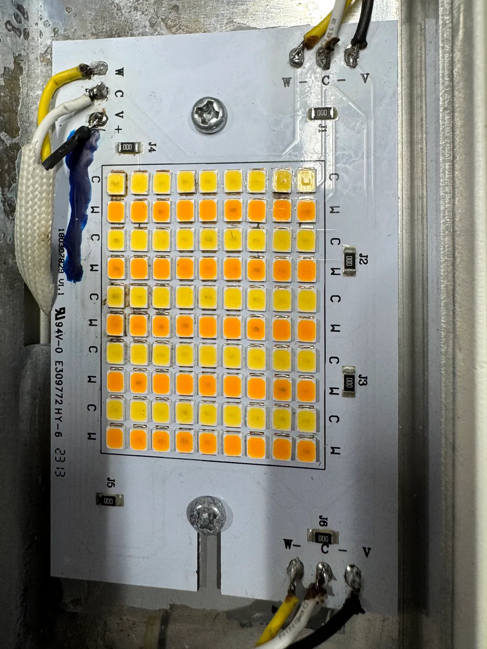 The outdoor LED board after repair, with the wiring connections visible.